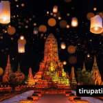 People celebrating Thai festival with lanterns and water