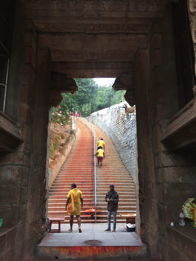 Srivari Mettu pilgrims climbing steep stairs surrounded by forest