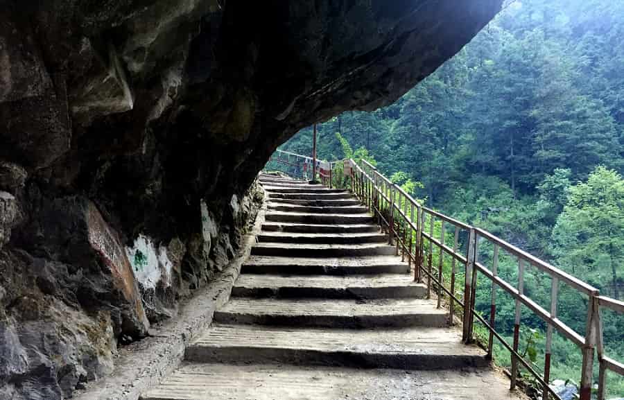 Stone steps along the Yamunotri trekking route carved through rocky cliffs in the Garhwal Himalayas