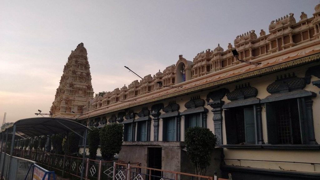 Sri Tirupatamma Ammavari Temple exterior in Penuganchiprolu, Andhra Pradesh, showcasing traditional South Indian temple architecture at dusk.