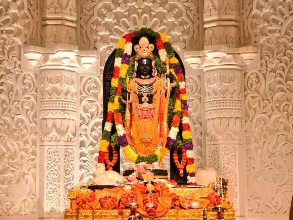 Ram Lalla idol inside Ayodhya Ram Mandir sanctum decorated with colorful garlands
