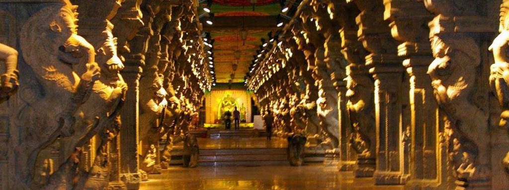 Arunachaleswarar Temple interior corridor with carved stone pillars and divine lighting in Tiruvannamalai