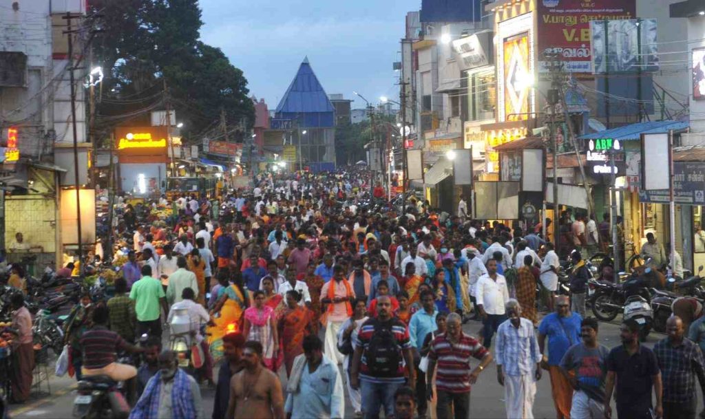 Devotees performing Girivalam around Arunachala Hill during full moon in Tiruvannamalai