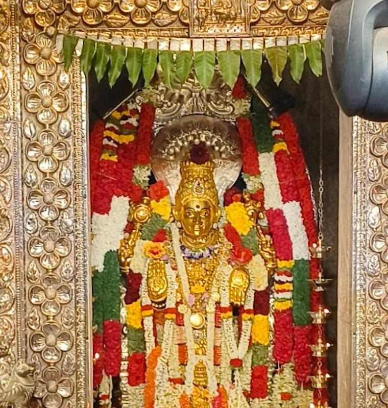 Golden idol of Goddess Annapoorneshwari decorated with flowers at Horanadu Temple Karnataka