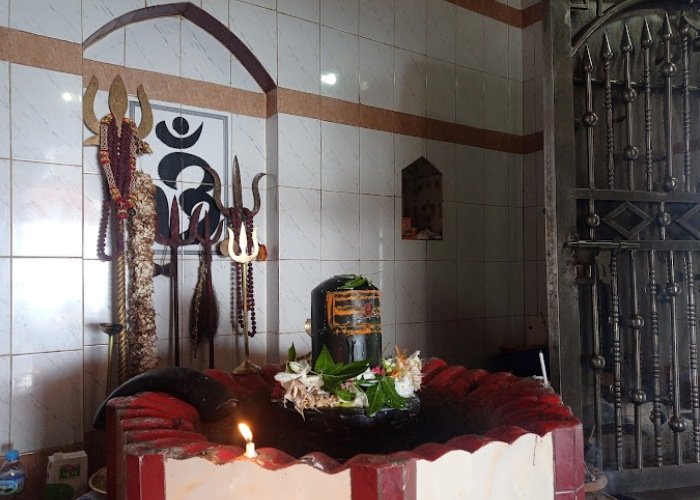 Shiva Lingam inside Chandranath Temple Sitakunda with trident and sacred offerings