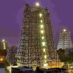 Meenakshi Amman Temple gopuram illuminated at night Madurai