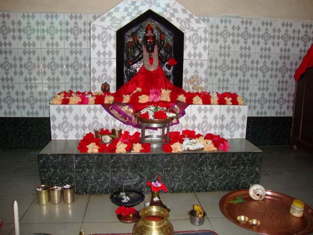 Goddess Sunanda idol at Sugandha Shaktipeeth Shikarpur Bangladesh decorated with flowers and offerings