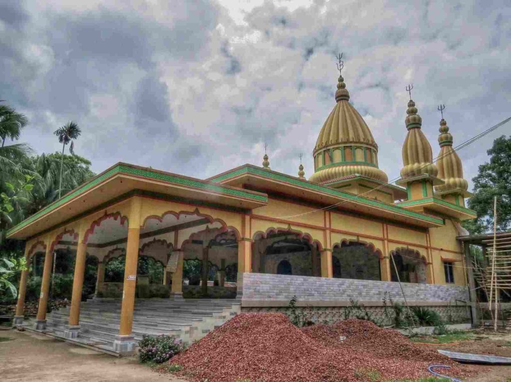 Sugandha Shaktipeeth temple exterior view in Shikarpur Bangladesh with golden domes and traditional architecture