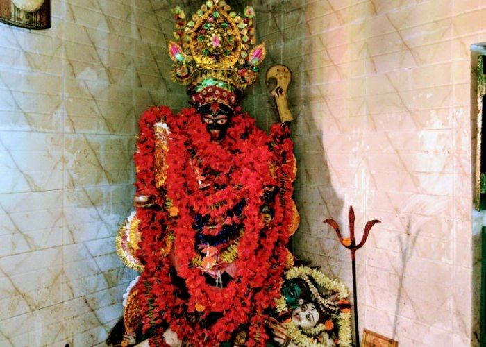 Goddess Anandamayee idol at Ratnavali Shakti Peeth adorned with red flowers and ornaments