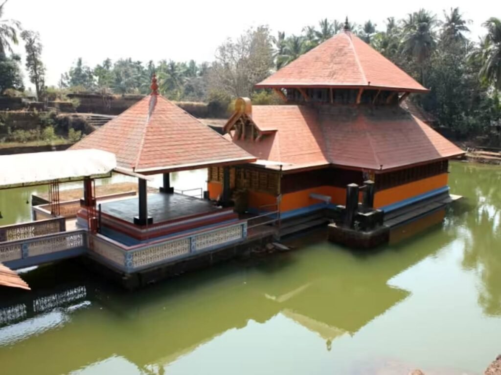 Ananthapura Lake Temple in Kasaragod surrounded by calm green waters and traditional Kerala architecture.
