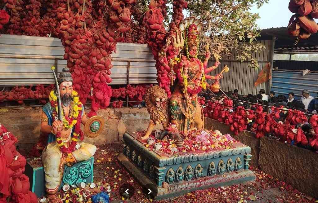 Goddess Kateramma idol at Kateramma Temple Hoskote surrounded by sacred red cloth offerings and devotional decorations.