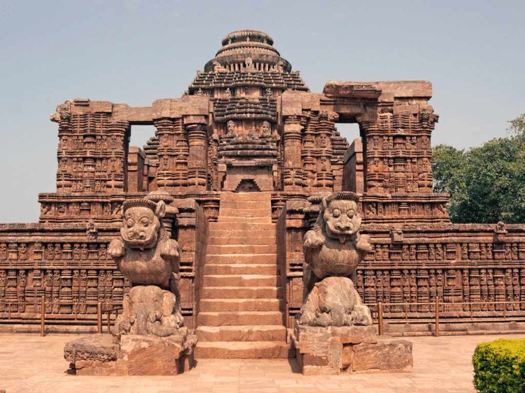Historic stone structure of Konark Sun Temple with carved lion sculptures and traditional Odisha temple design.