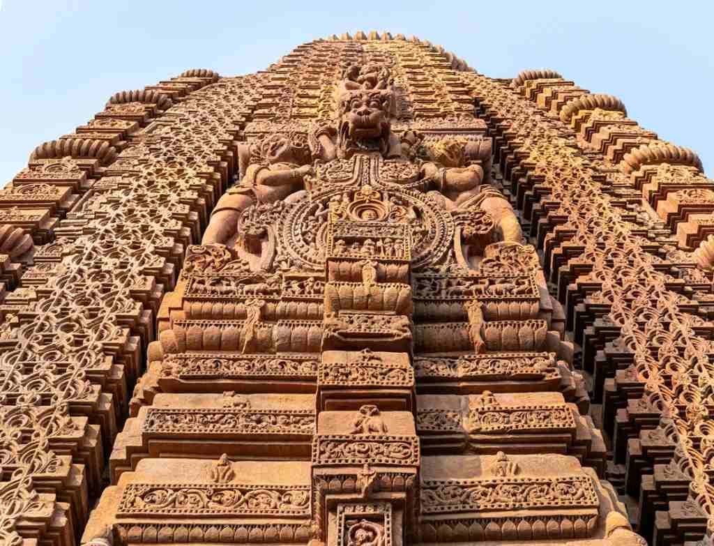 Detailed carvings on Mukteswara Temple tower in Bhubaneswar highlighting ancient Odisha temple artistry.