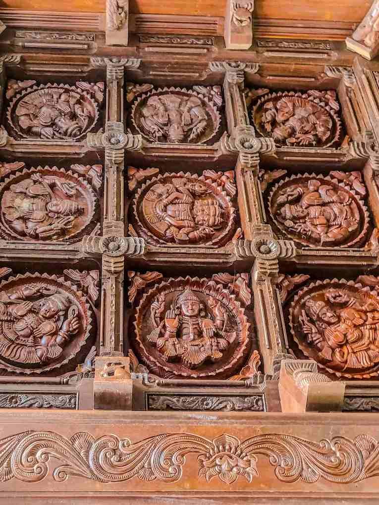 Traditional wooden carvings and temple artwork inside Mannarasala Sree Nagaraja Temple