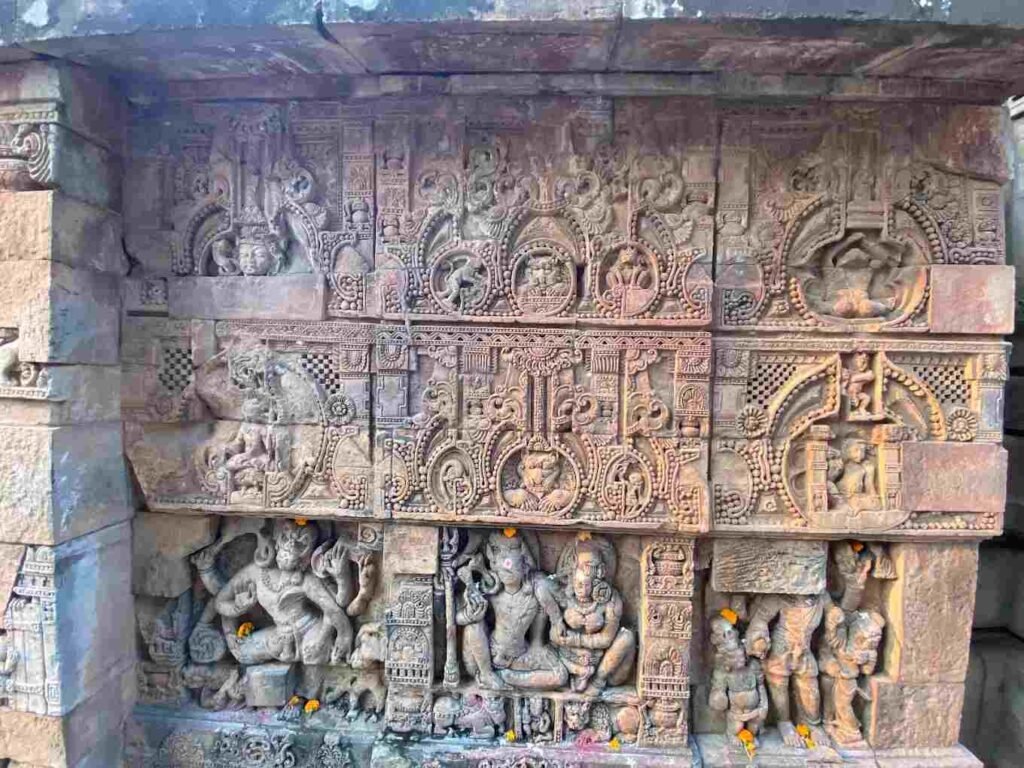 Ancient sculptural artwork and decorative stone carvings on the exterior wall of Raja Rani Temple, Bhubaneswar.