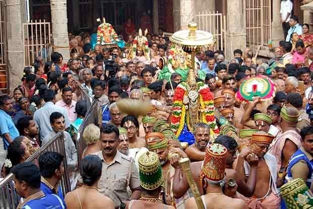 Devotees participating in a grand procession at Srirangam Ranganathaswamy Temple