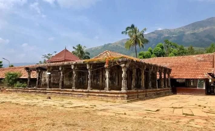 Ancient Thirunelli Temple in Wayanad surrounded by hills and scenic natural beauty.