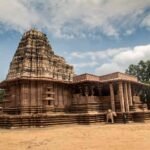 Ramappa Temple in Warangal, Telangana, showcasing magnificent Kakatiya architecture and the iconic sandstone structure under a blue sky.