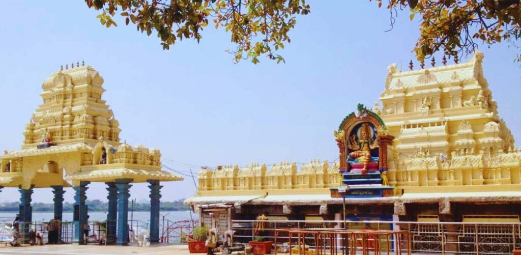 Front view of Sri Bhadrakali Temple Warangal with temple towers and Bhadrakali Lake in the background.