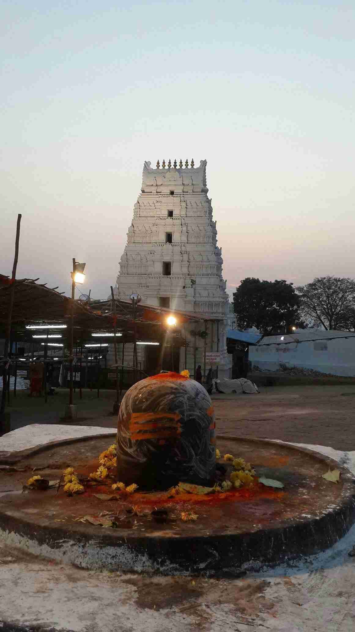 Sacred Shiva Lingam with Keesaragutta Temple gopuram in the background