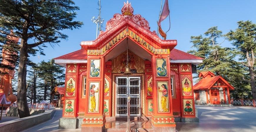 Front view of Jakhu Hanuman Temple in Shimla with colorful traditional architecture