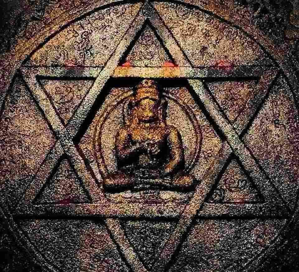 Sacred idol of Lord Hanuman seated inside a mystical Yantra at Yantrodharaka Hanuman Temple, Hampi.